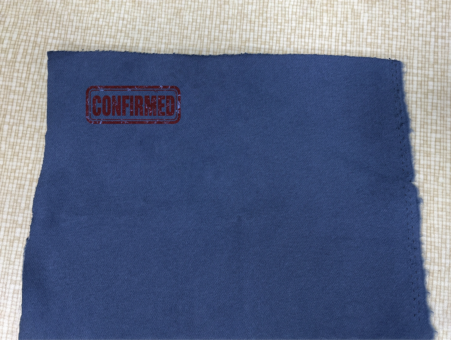 Approved knit fabric material reference reviewed with garment sample and development records