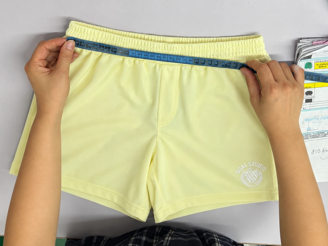 Garment measurement and key construction position check before activewear bulk production