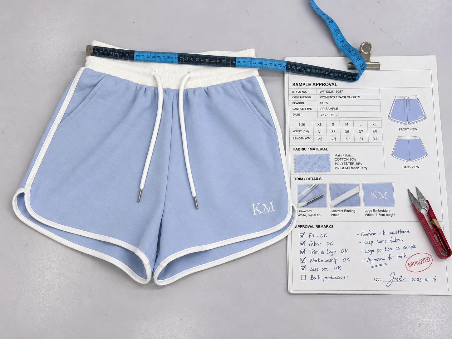 Approved knit garment sample with supporting development references