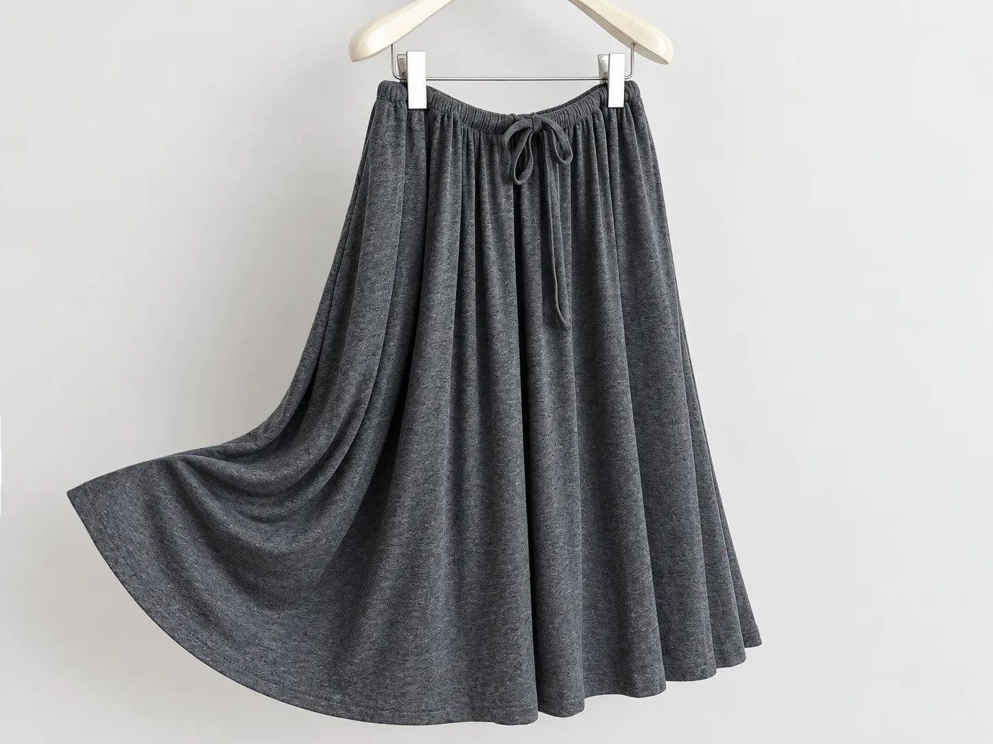Knit garment hem and stitching construction detail