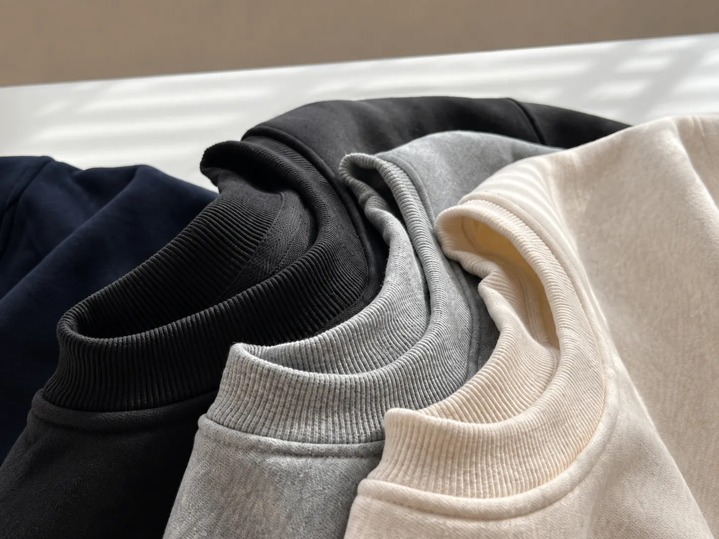 Knit garment neckline and rib construction detail