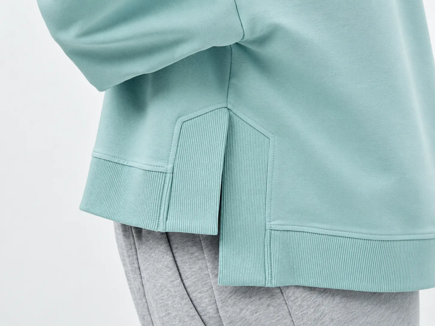 Panel and seam construction detail on knit sportswear garment