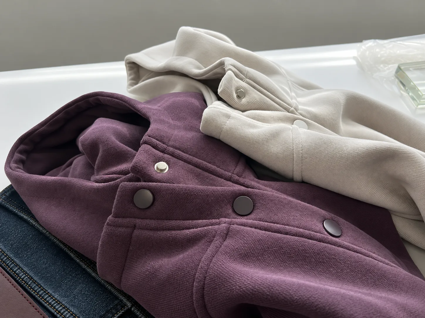 Polo shirt placket construction detail on knit garment