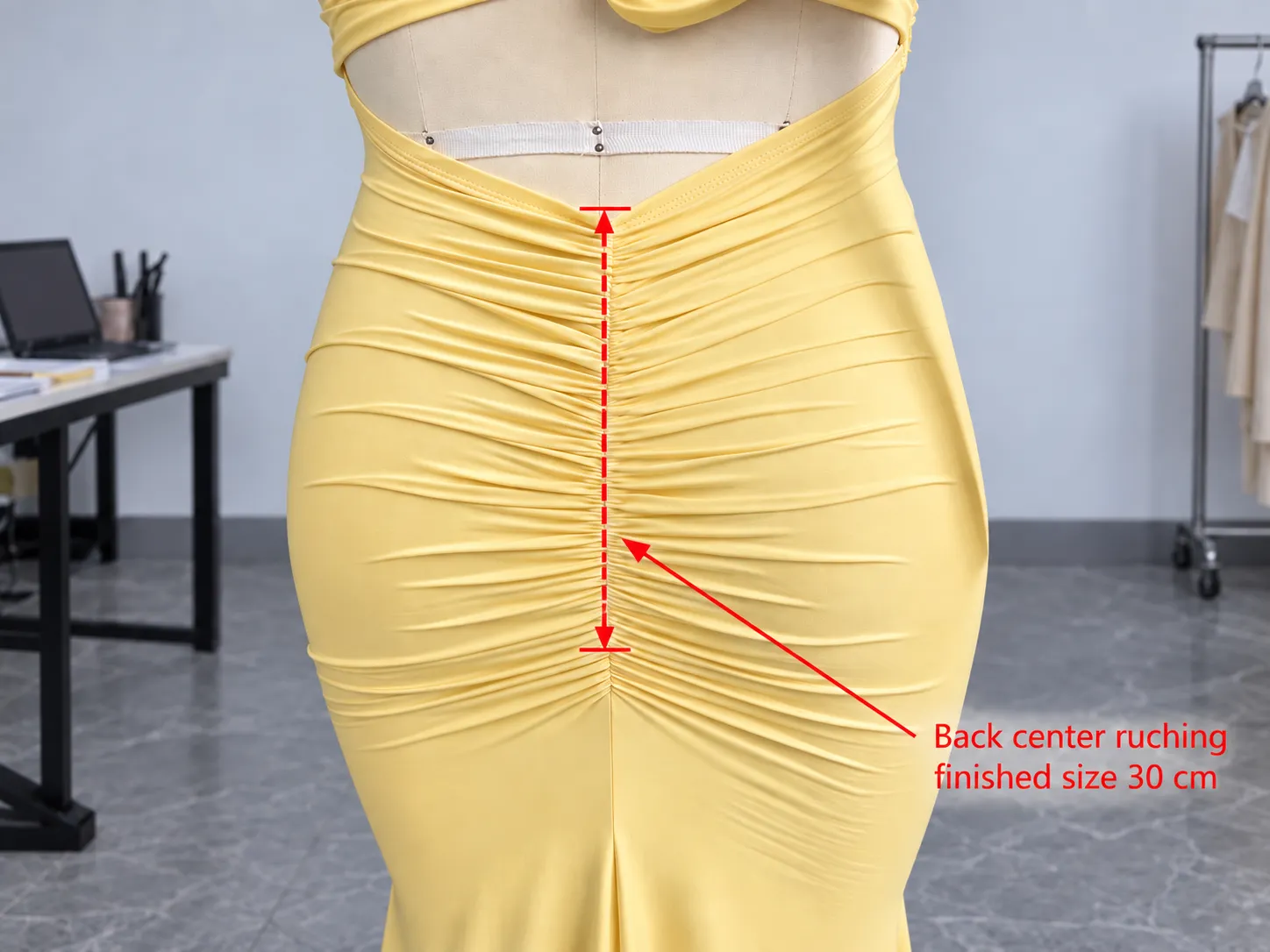 Approved knit garment sample and production references checked before bulk production