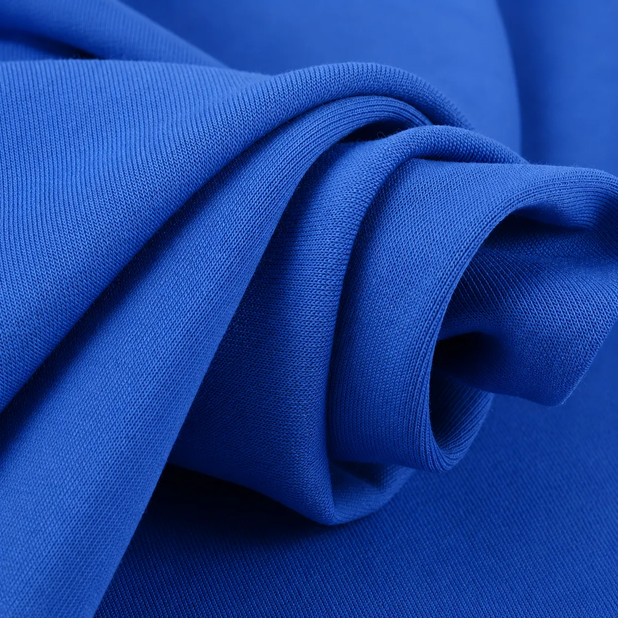 Interlock knit fabric showing stable smooth surface for structured garments