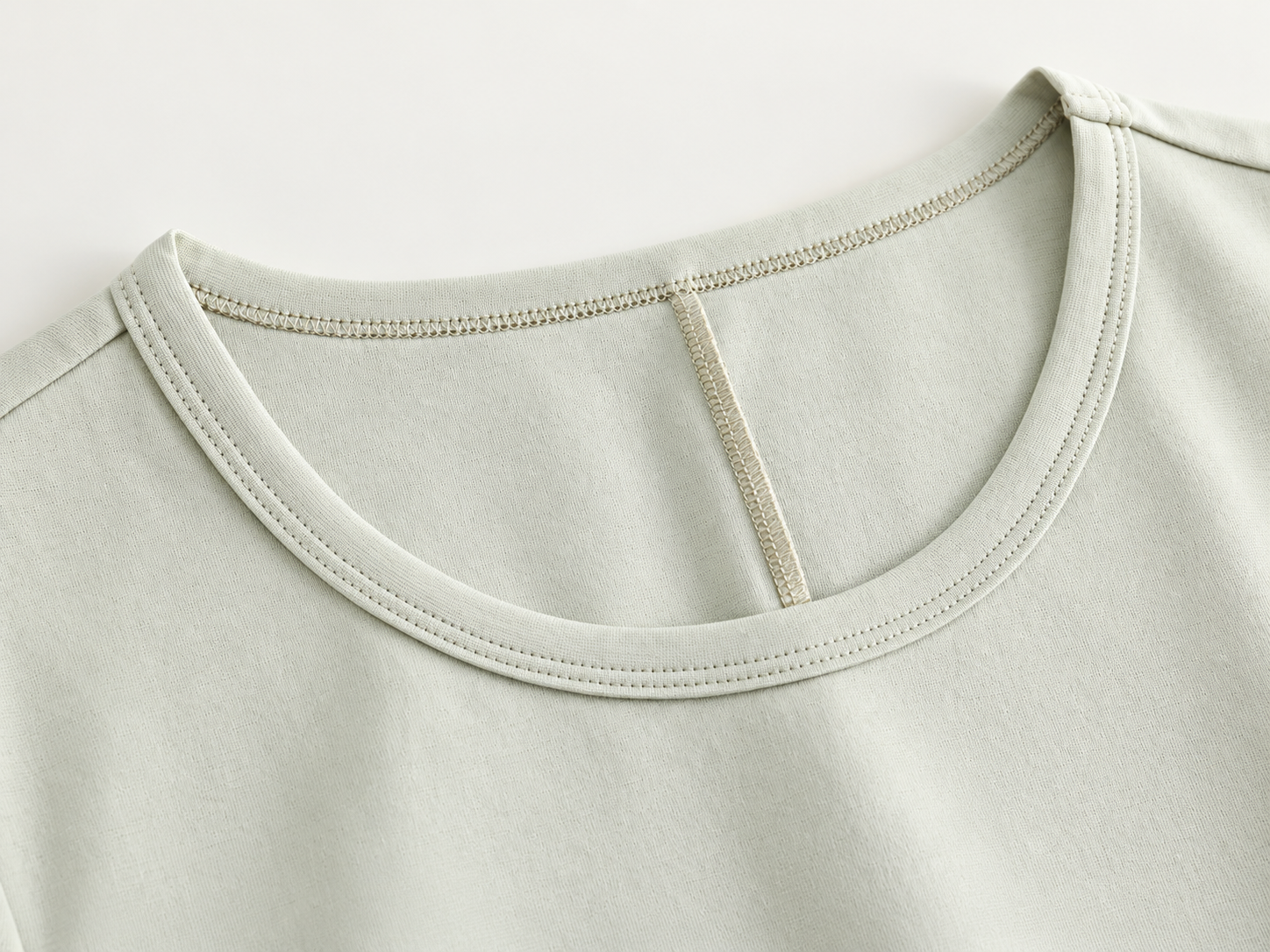 Knit dress neckline and shoulder construction detail