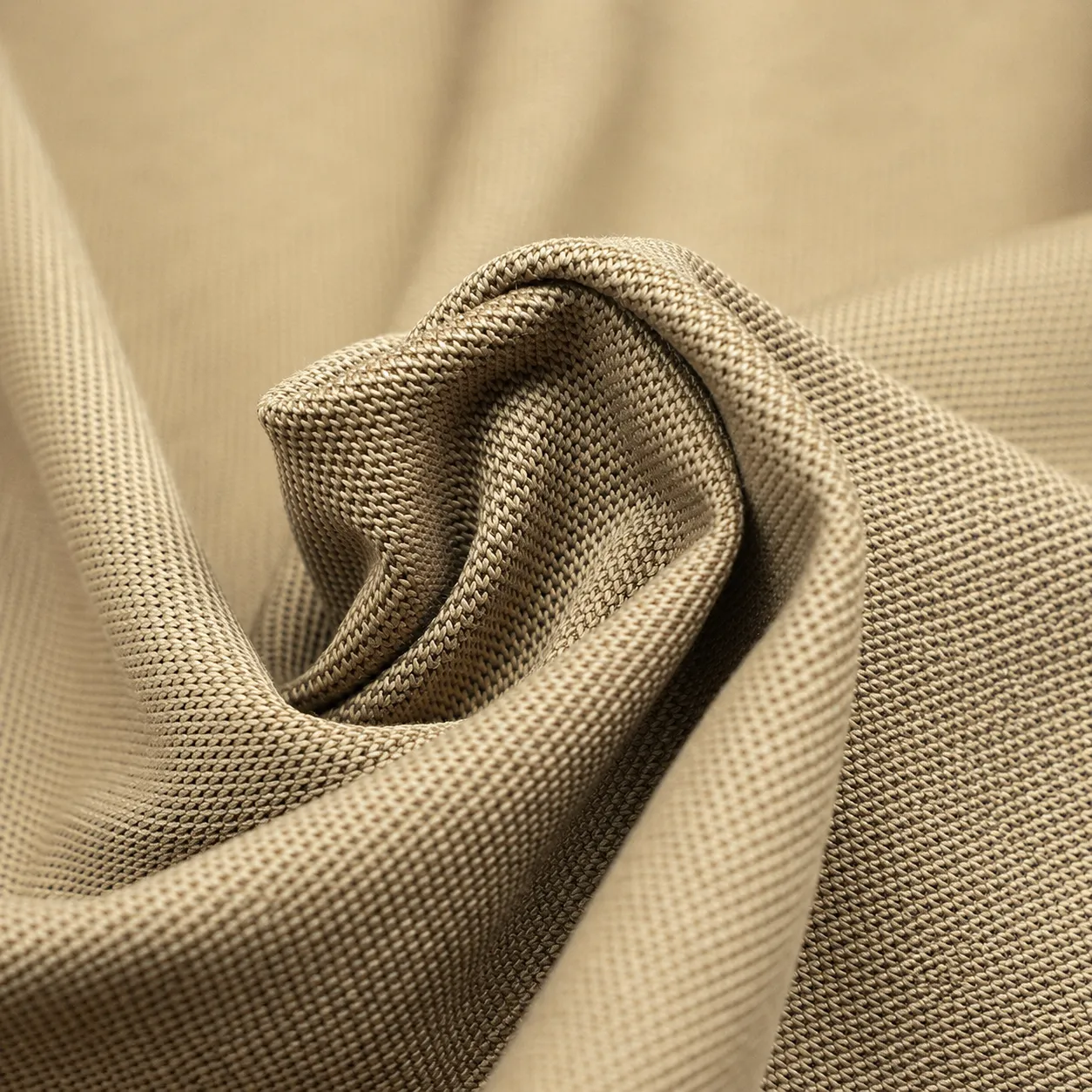 Pique knit fabric showing textured surface for polo shirts and structured casual tops
