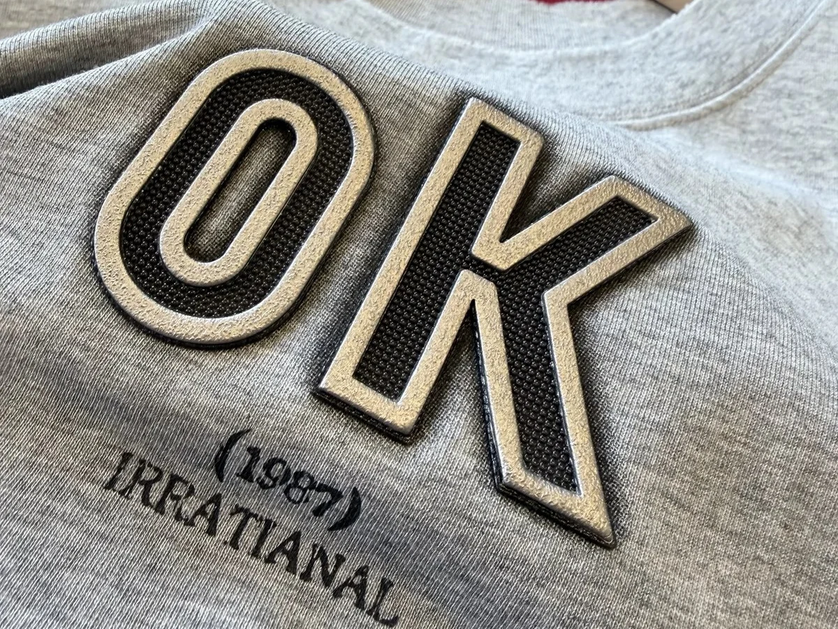 Printing and heat transfer applied to a cut-and-sew knit garment