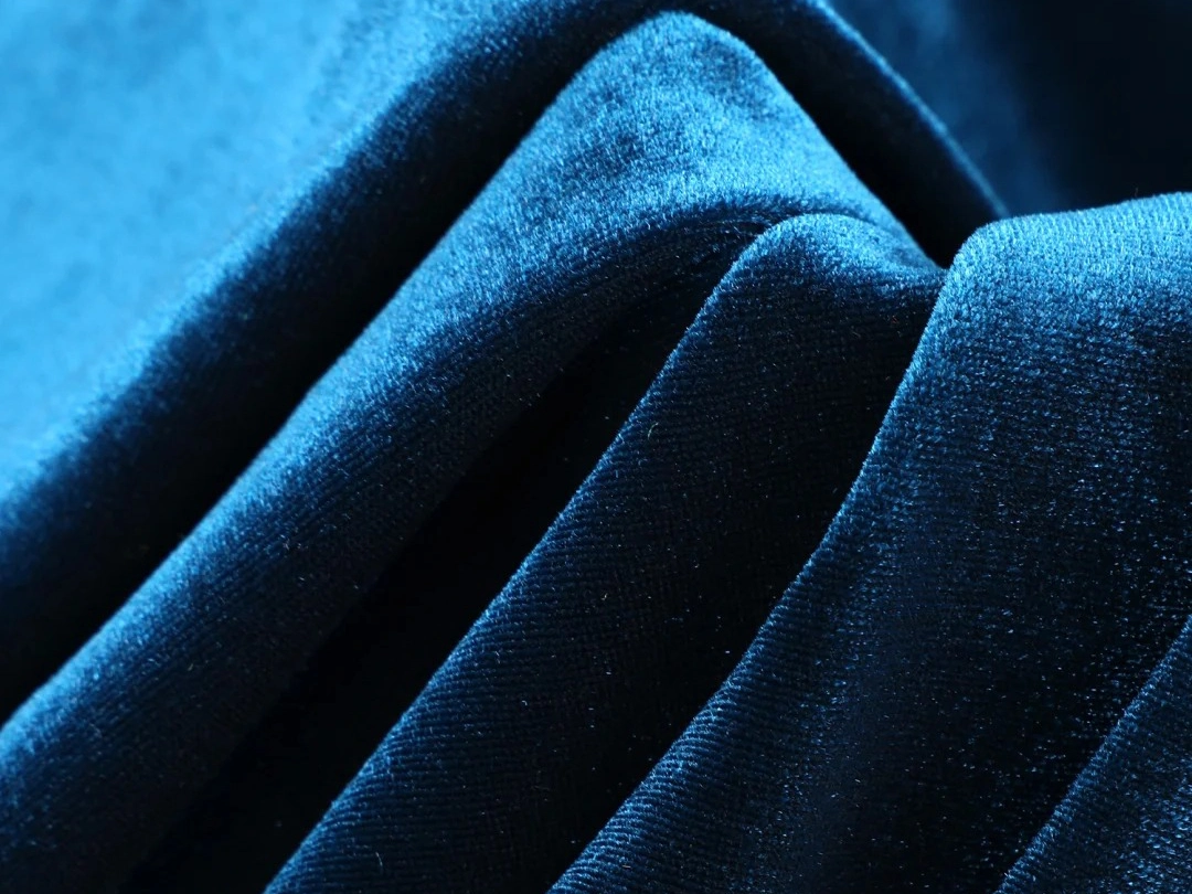Velour knit fabric pile surface
